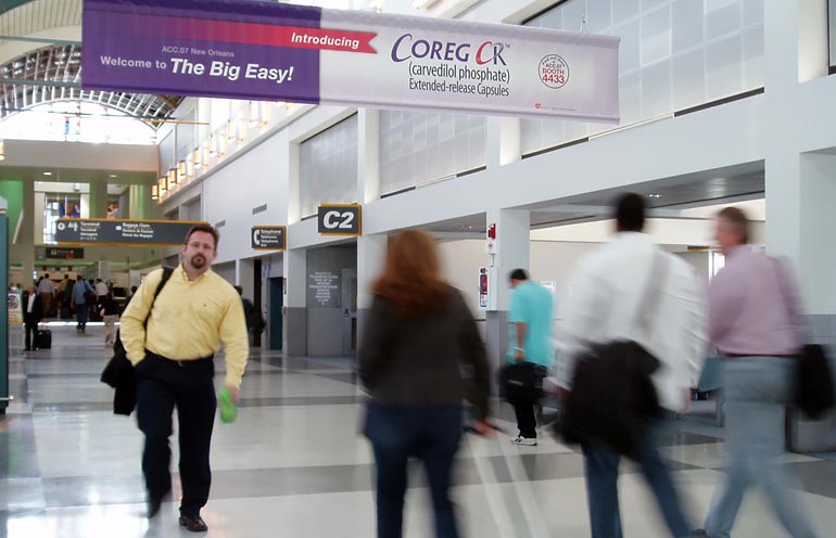 Image of airport advertising banner used to reach arriving event attendees in New Orleans