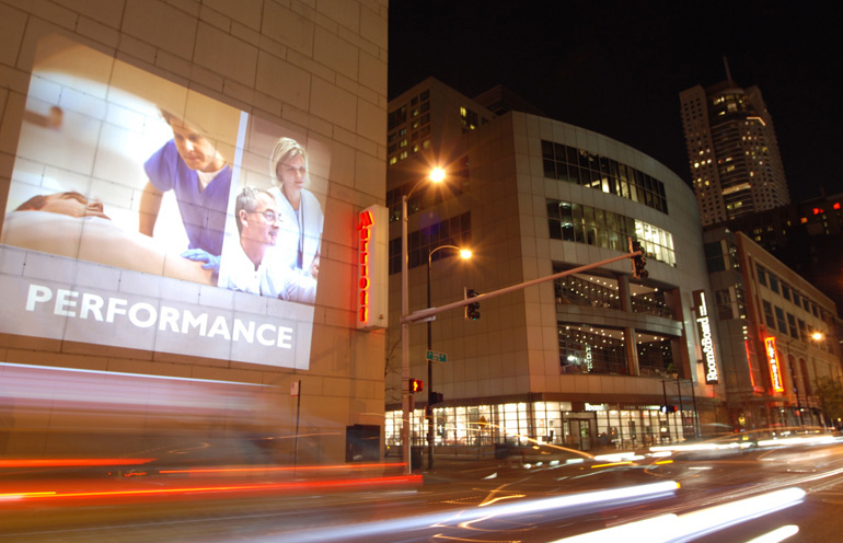 Mobile projection advertising for an event in Chicago
