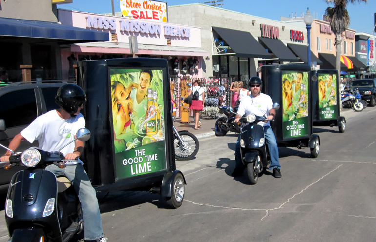 Image of a group of scooters ads being used in San Diego