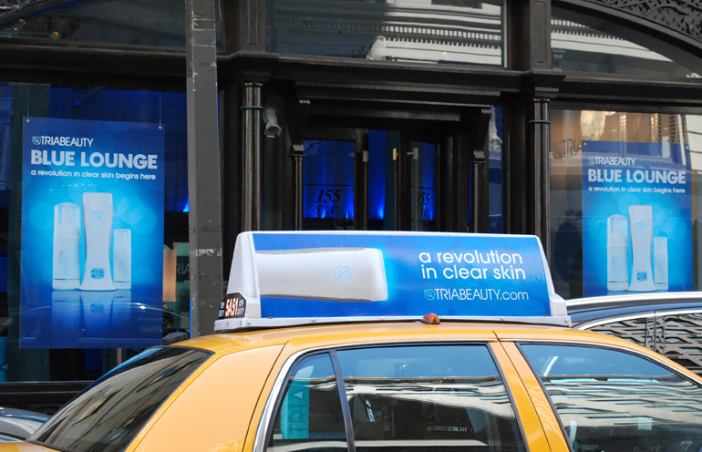 Image of taxi advertising in New York to promote the opening of a retail location