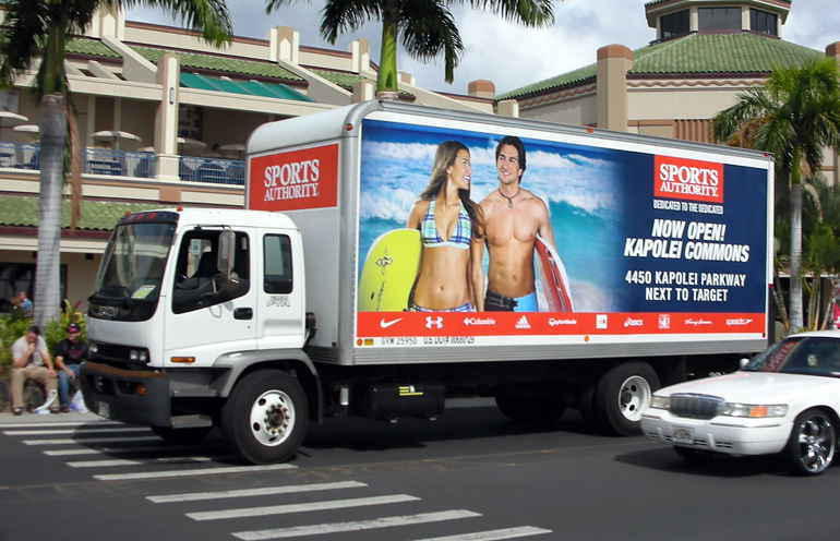 Image of truckside advertising in Hawaii to promote the grand opening of a retail location