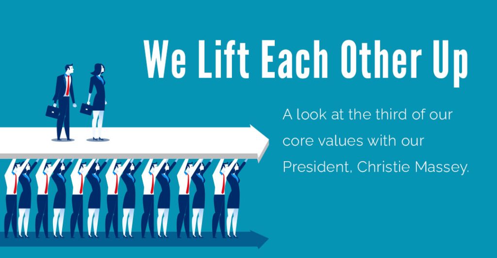 an image of team members lifting each other up