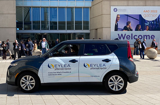 a wrapped vehicle ad for a medical conference